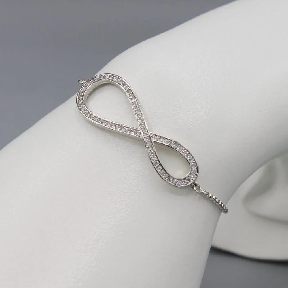 Jewelry bracelet infinity style white gold tone with stones sparkly adjustable